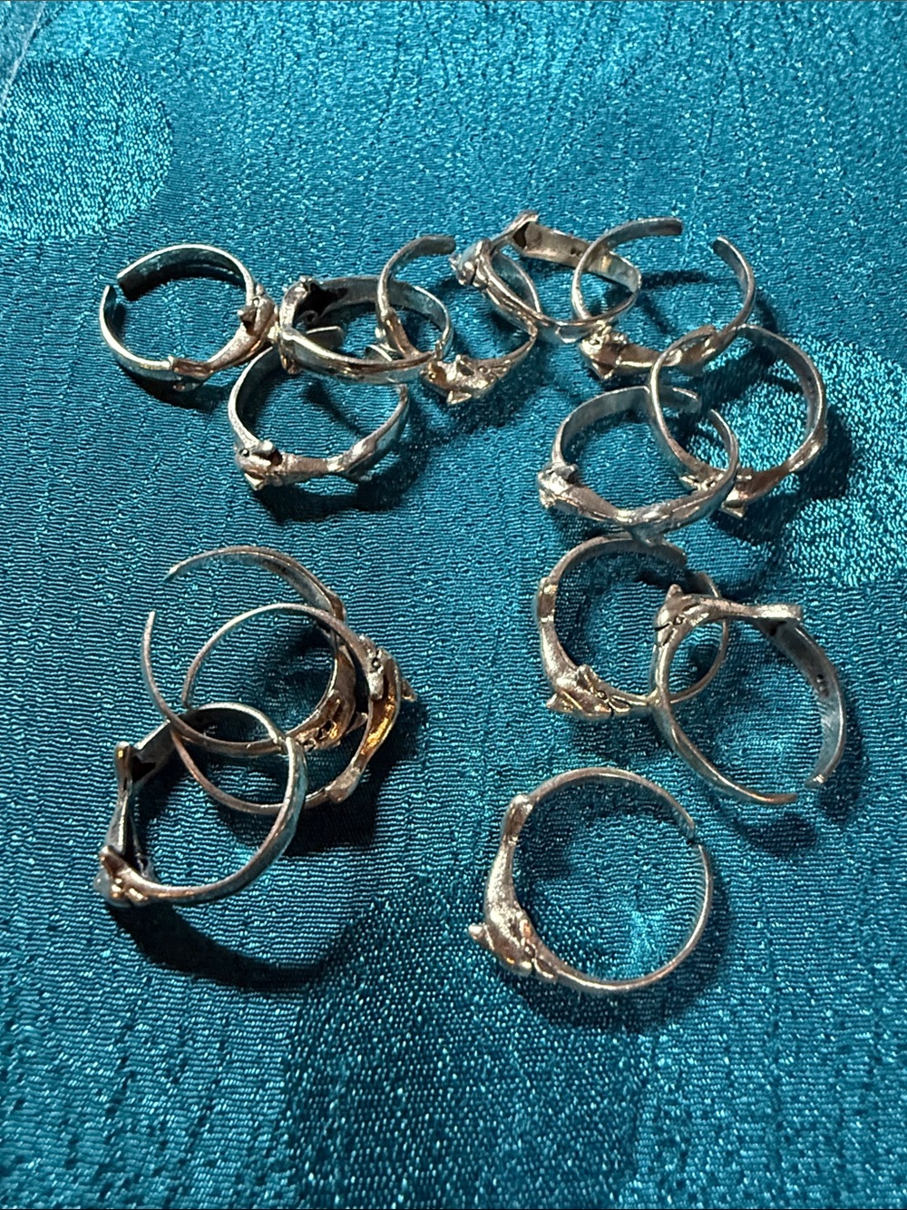Set of 14 dolphin toe rings in sterling silver